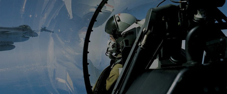 Pilot in the F-16 General Dynamics Fighting Falcon cockpit in the air.