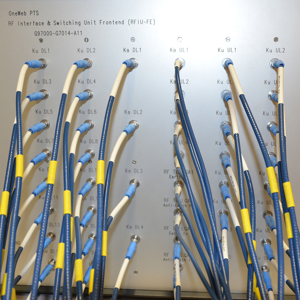 Cables on the backside of a radio frequency test and calibration, RF SCOE.