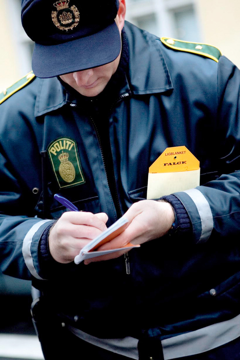 Police Officer writing a note.