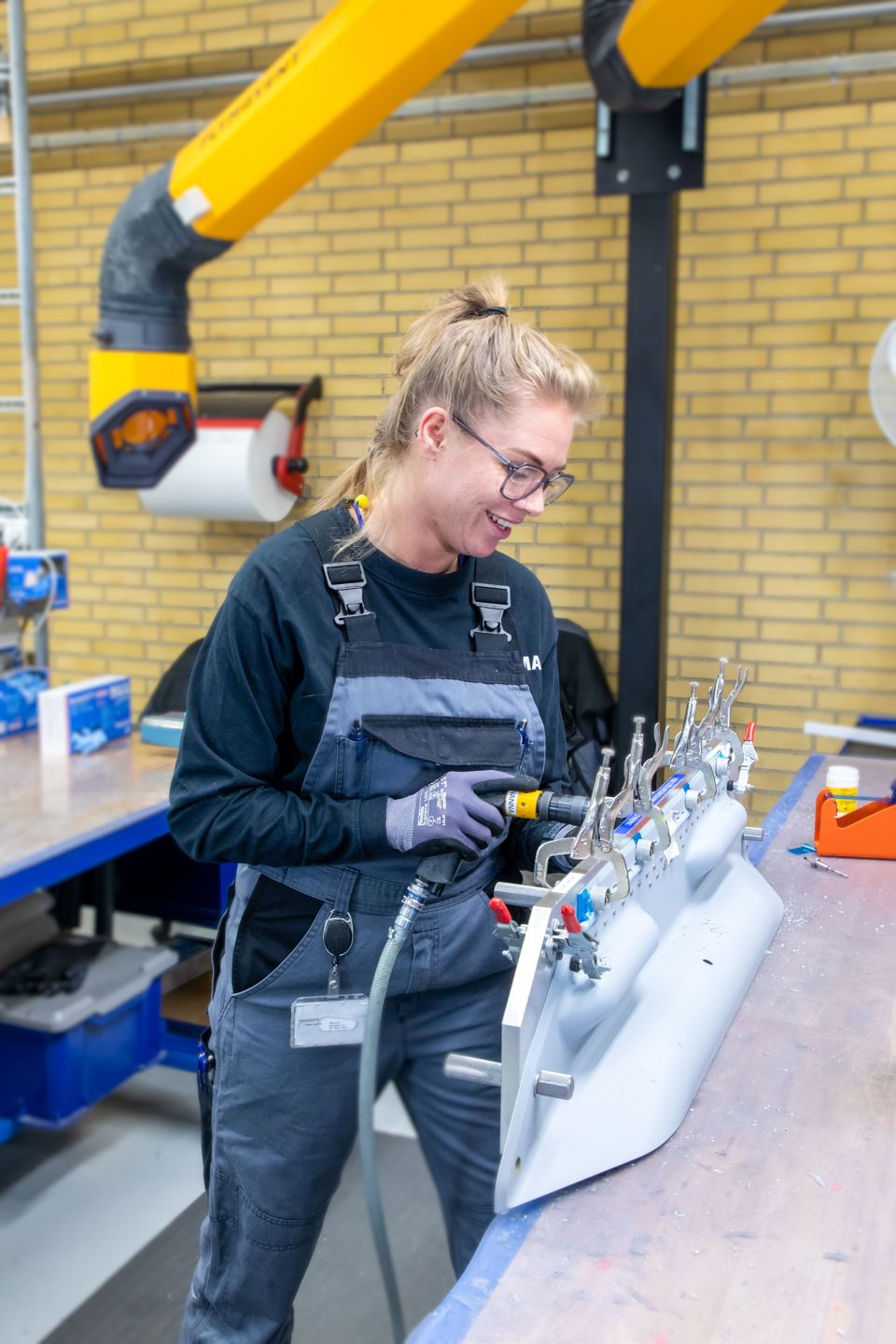 Terma employee performing assembly of an F-35 composite.