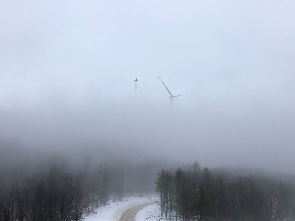 Wind turbine in foggy weather in the USA.