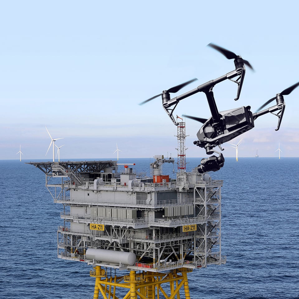 Drone by an offshore rig platform.