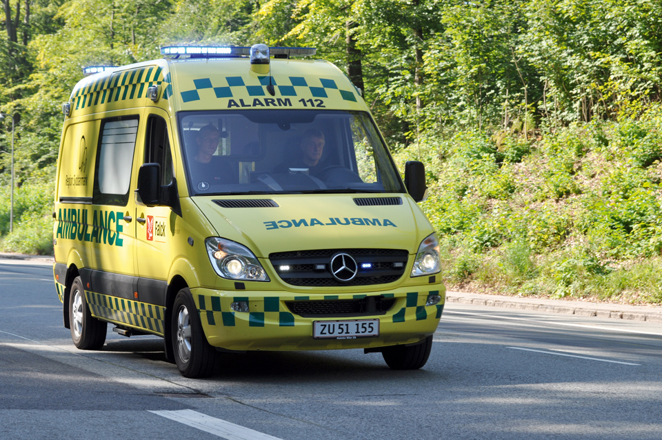 Ambulance driving on the street.