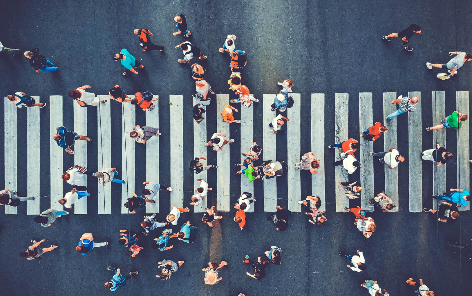 Aerial. People crowd motion through the pedestrian crosswalk. Top view from drone. Toned image.; Shutterstock ID 1529868773; purchase_order: -; job: -; client: -; other: -